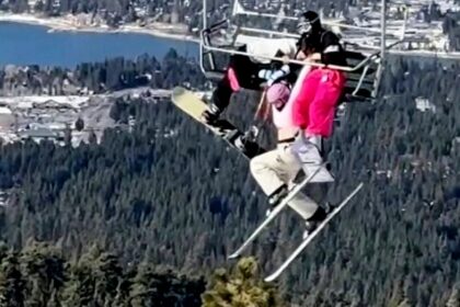 Skier's prank backfires, leaving her dangling 65 feet in the air as twin desperately holds on