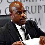 South African ex-police chief gets tissue stuck on forehead while sweating during corruption inquiry