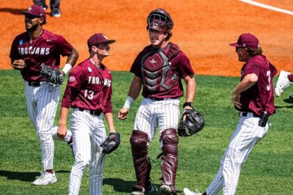 Little Rock baseball team celebrates with bus driver on the field after upset win to advance to Super Regional